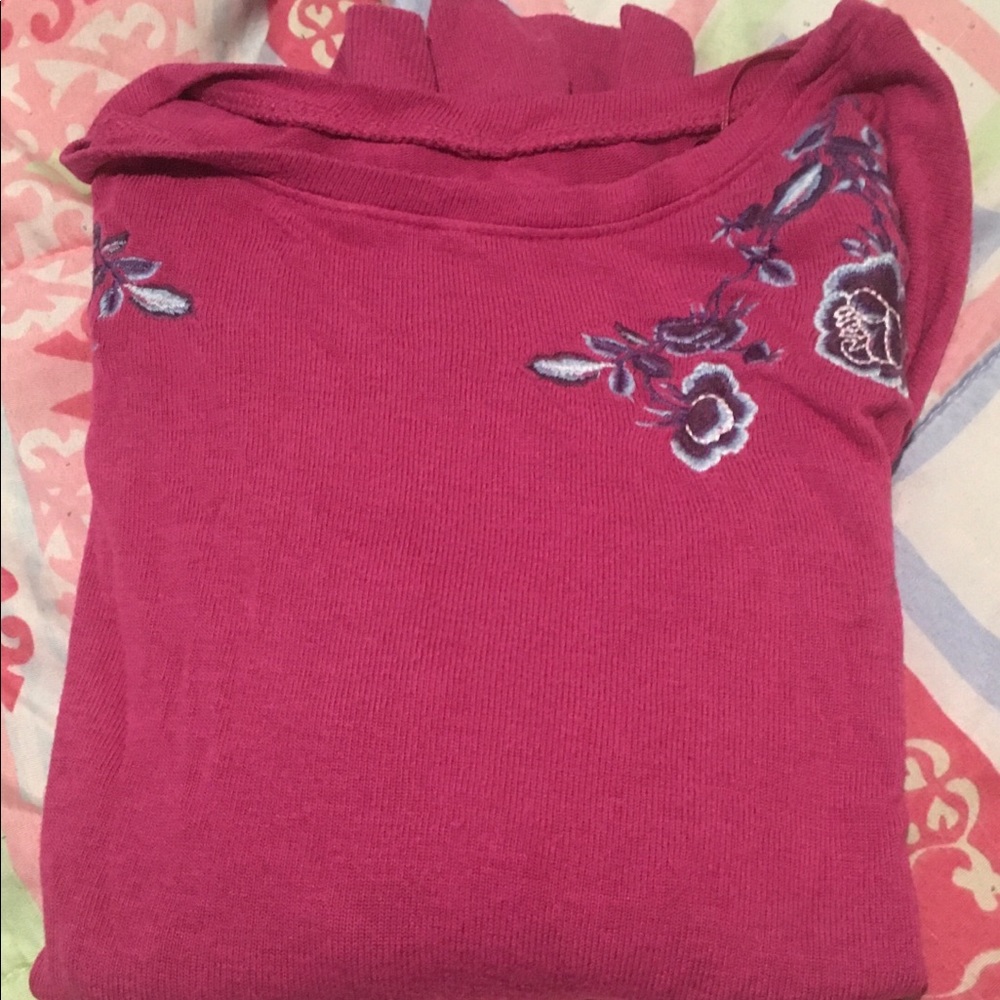 long sleeve top with floral design on shoulders